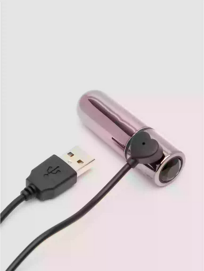 Metallic device with USB cable on a light gray background