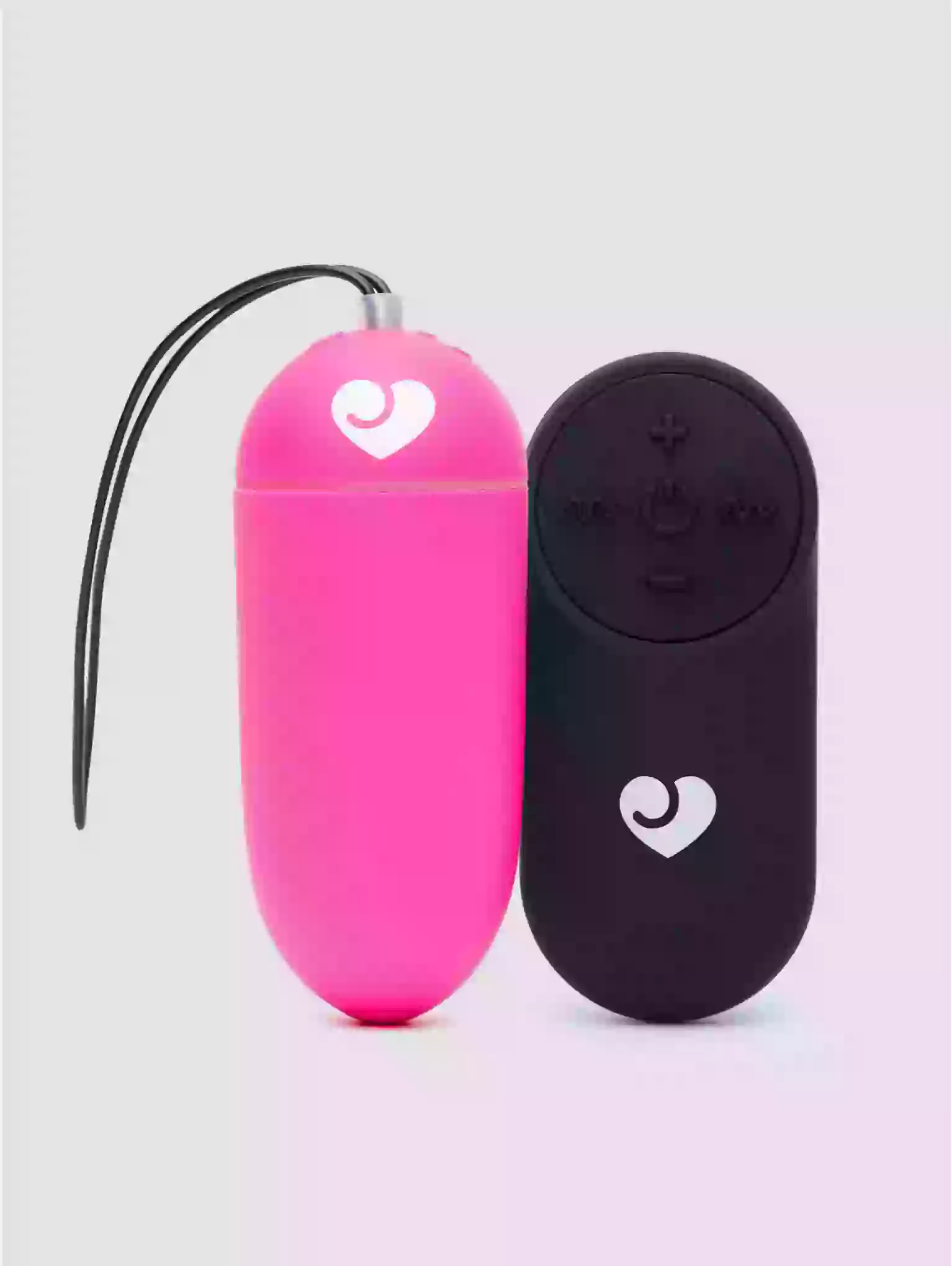 Pink and black electronic devices with heart symbols on a light gray background