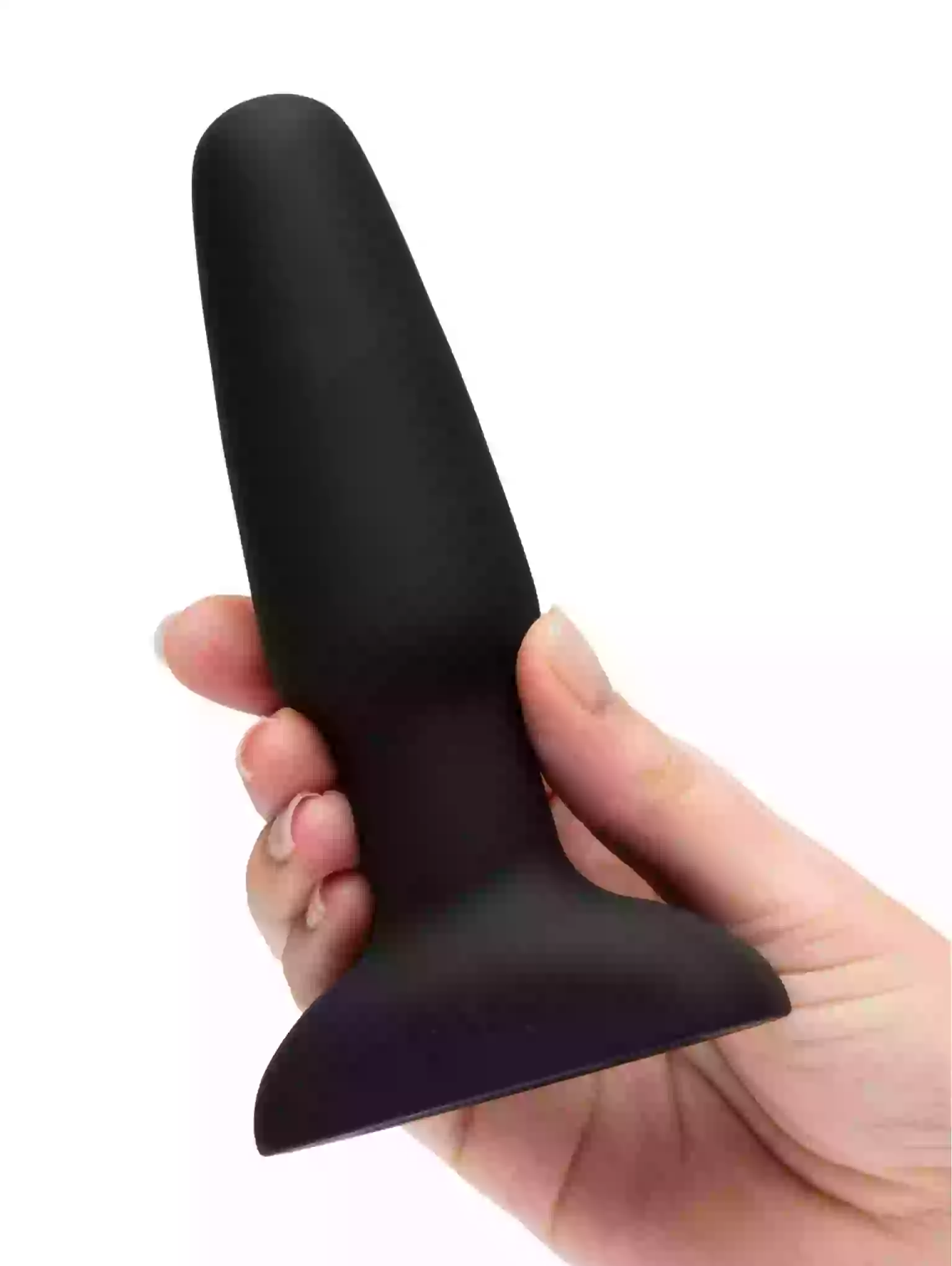 Black silicone product held in a hand against a white background