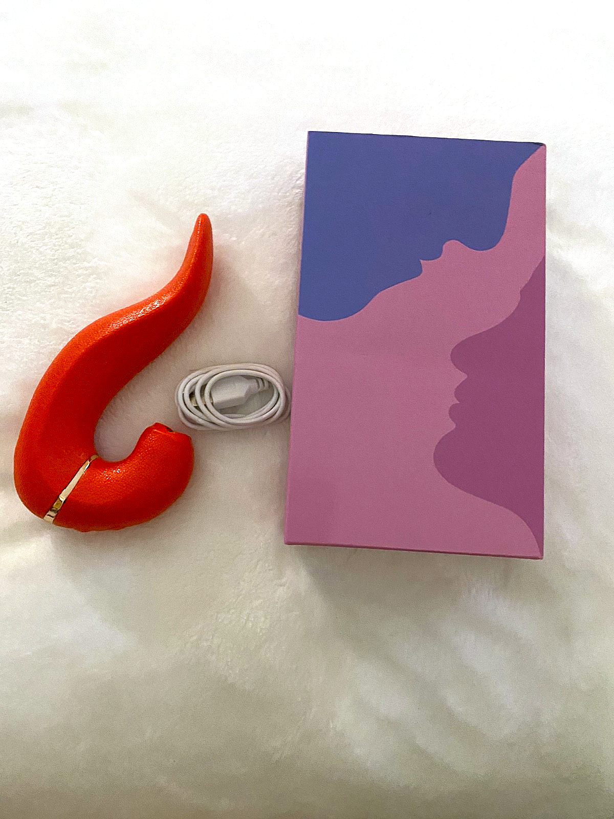 Red hook and white cable on a purple and pink box with a face silhouette on a white background
