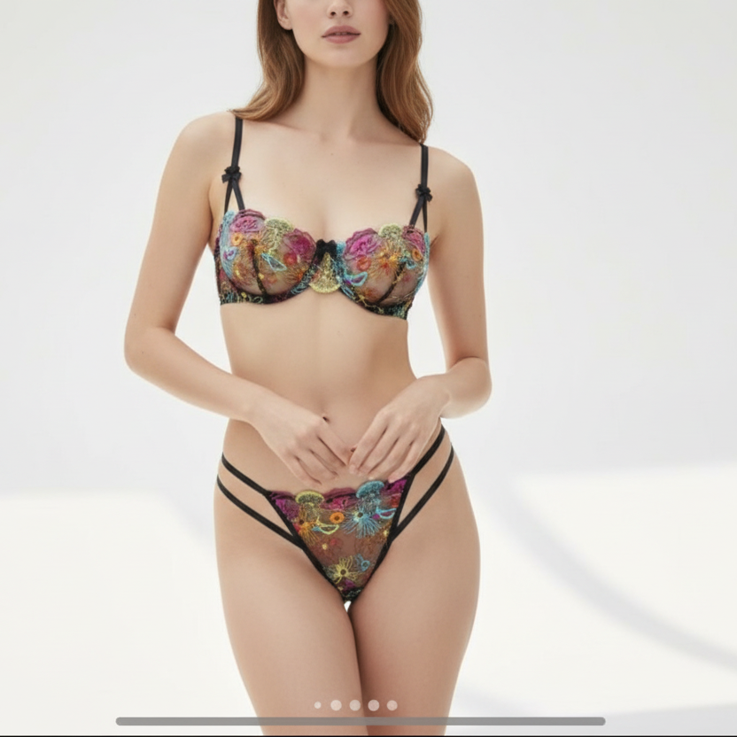 Woman wearing a colorful floral lingerie set on a white background