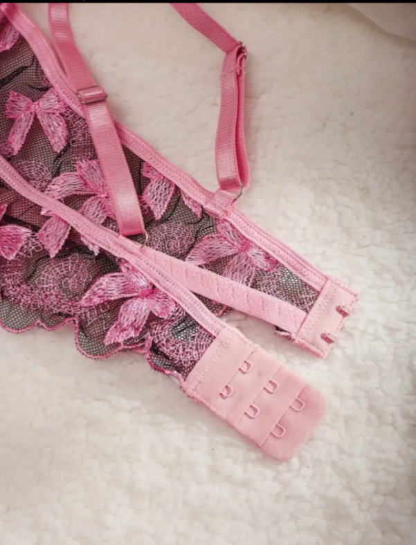 Pink lace lingerie set on a soft white background