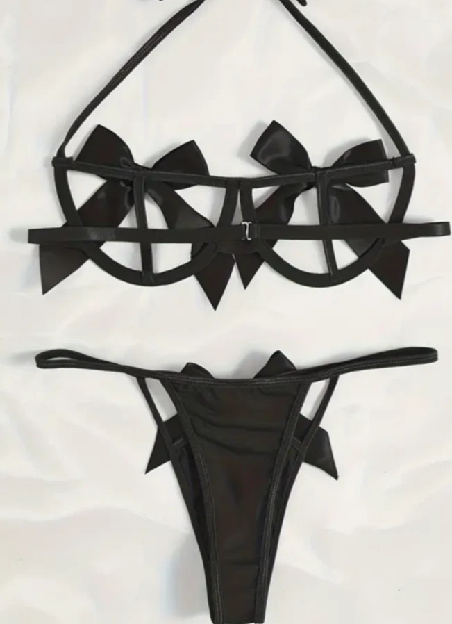 Black bikini set with bow details on a white background