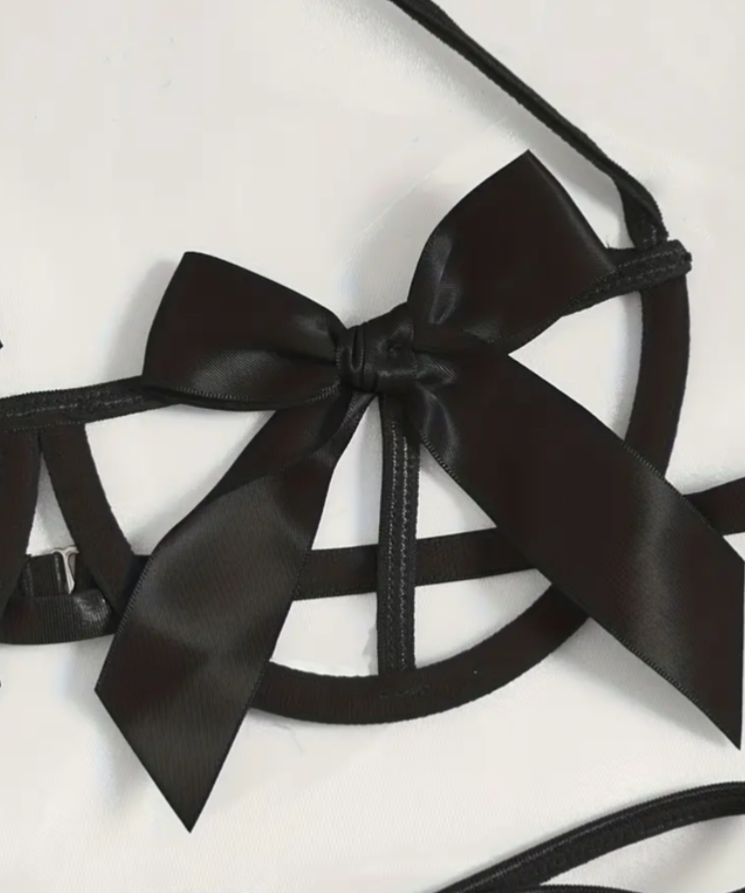Black satin bow and straps on a white background