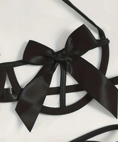 Black satin bow and straps on a white background
