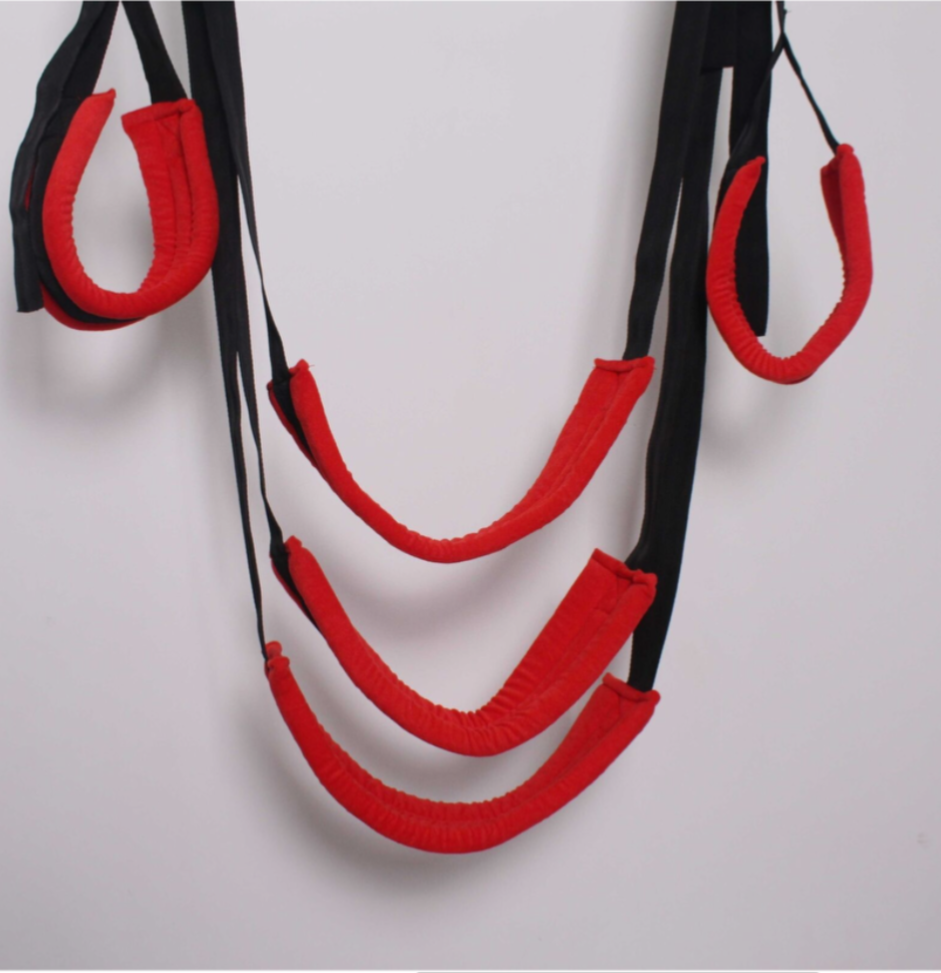 Red and black resistance band set on a light gray background