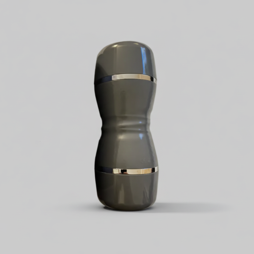 Gray and gold cylindrical object on a light gray background