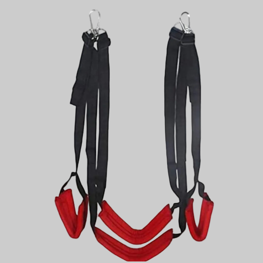 Black and red suspension training straps on a gray background