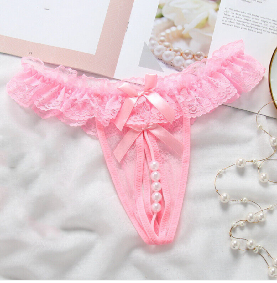 Pink lace thong with pearls on a light background