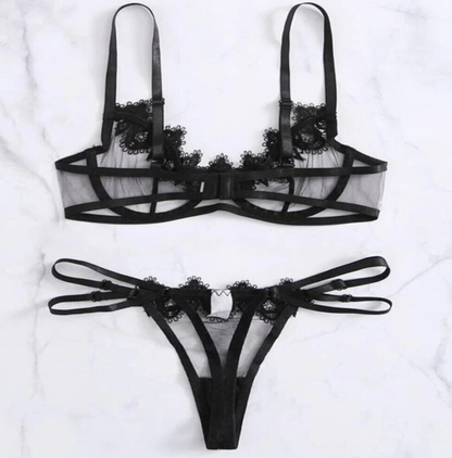 Black lace lingerie set on a white background