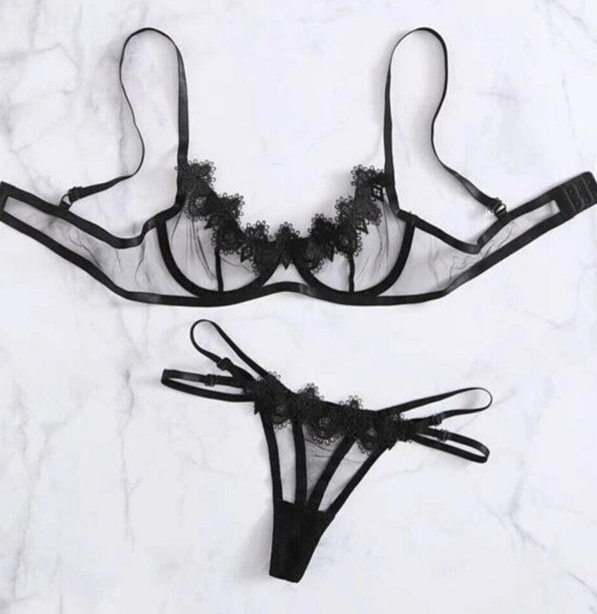 Black lace lingerie set on a white background