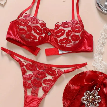 Red lingerie set with floral lace details on a beige background