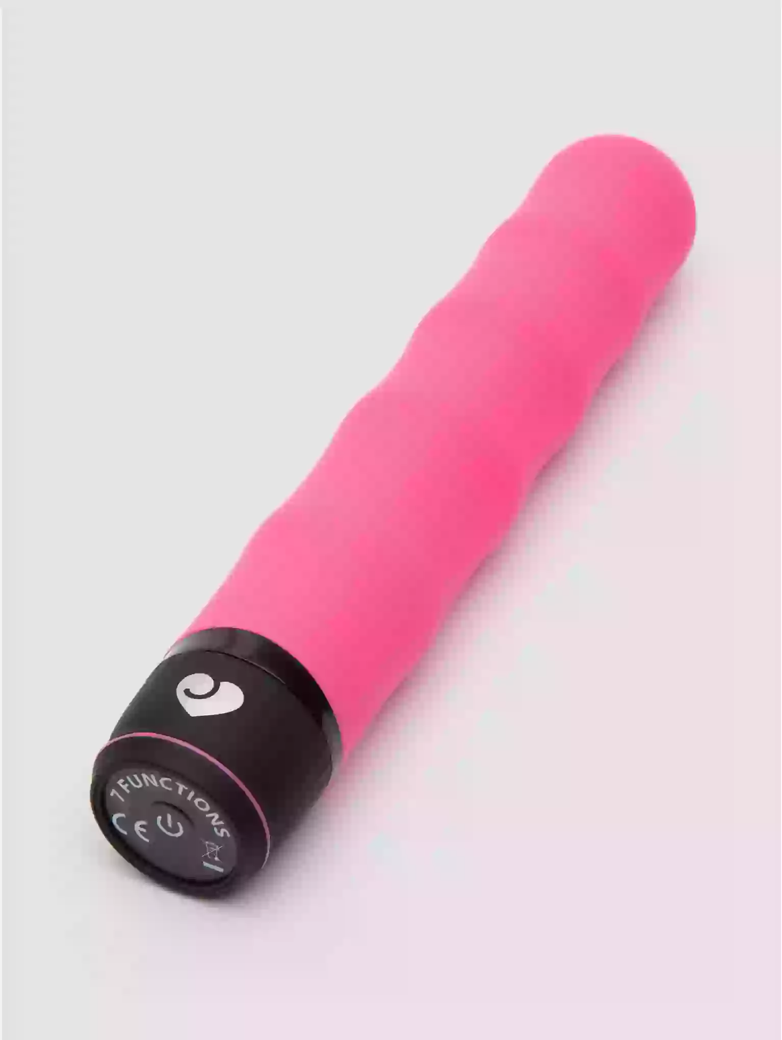 Pink and black electronic device on a light gray background