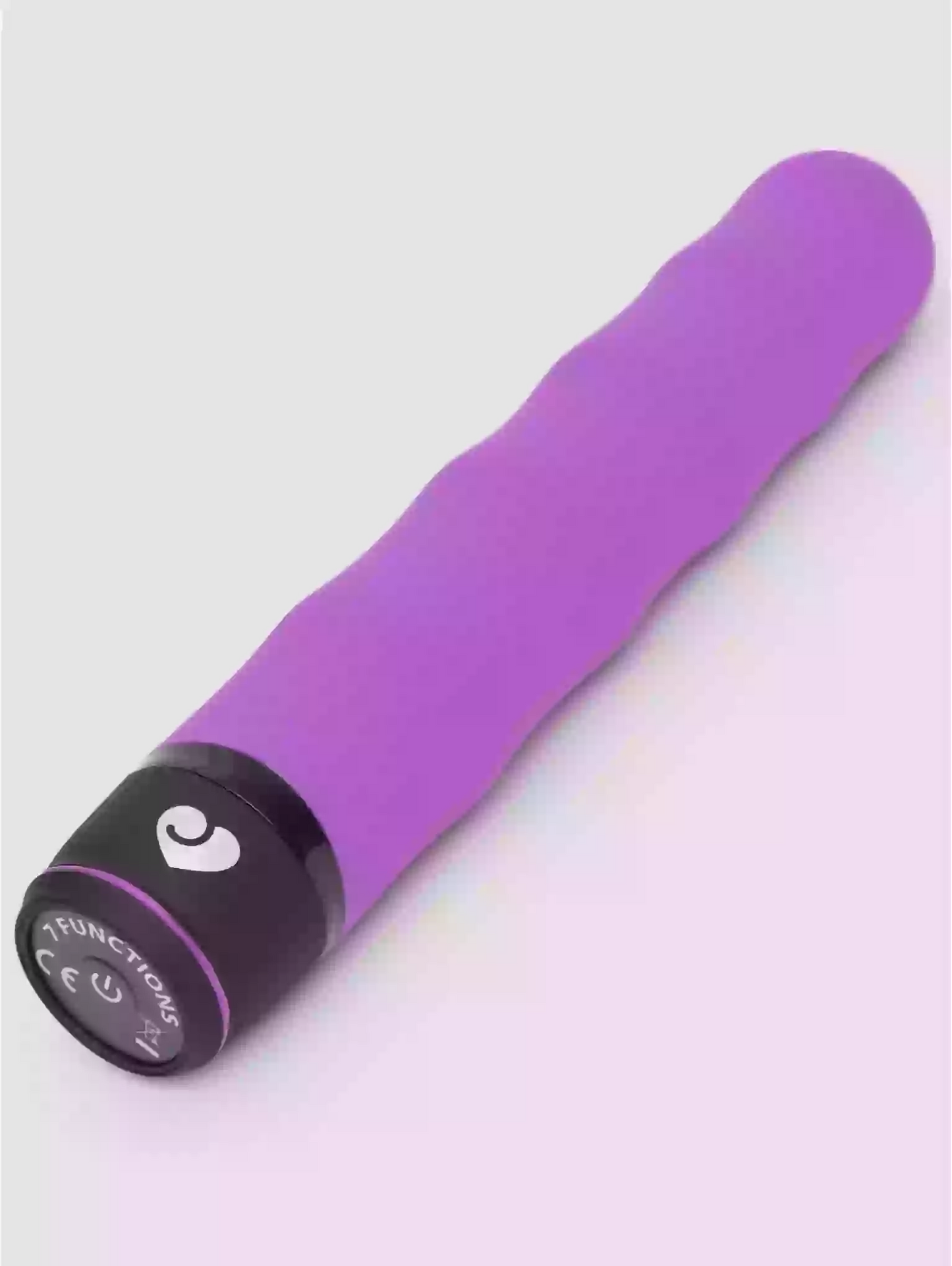 Purple toy with a black base on a white background