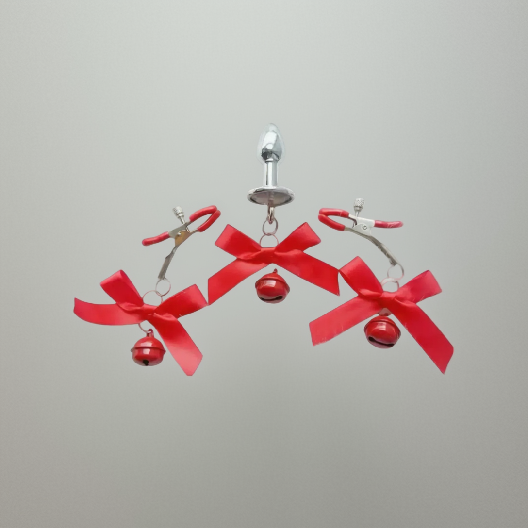 Earrings with red bows and small bells on a white background