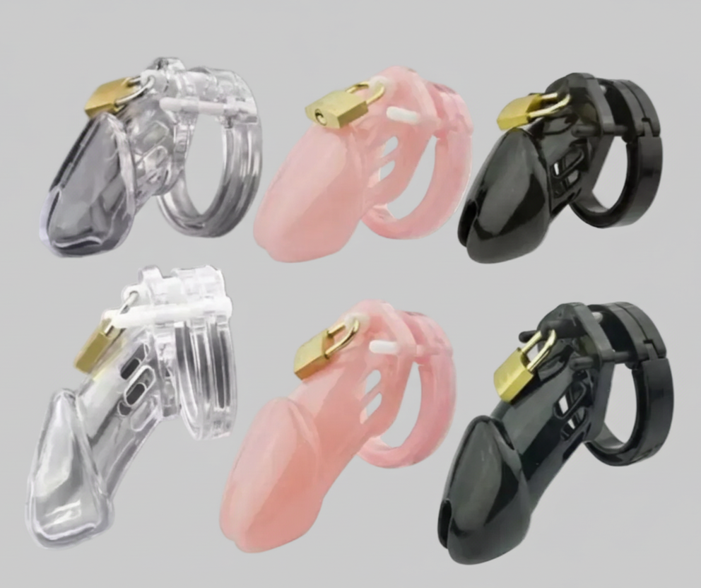 Set of three hearing aids in clear, pink, and black on a gray background