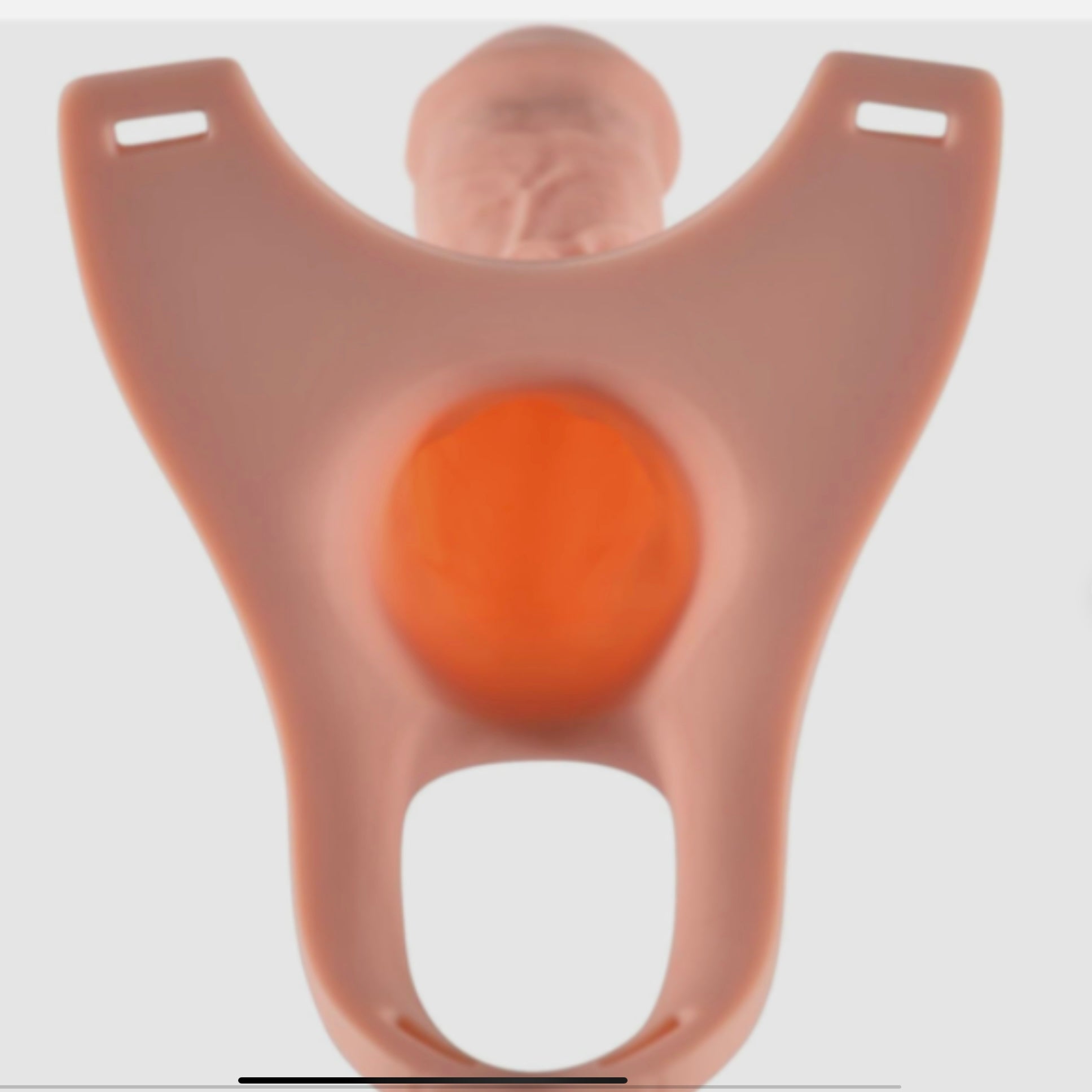 Silicone mold shaped like a person with an orange center on a white background
