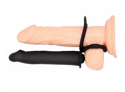 Sexual product with black and beige components on a white background