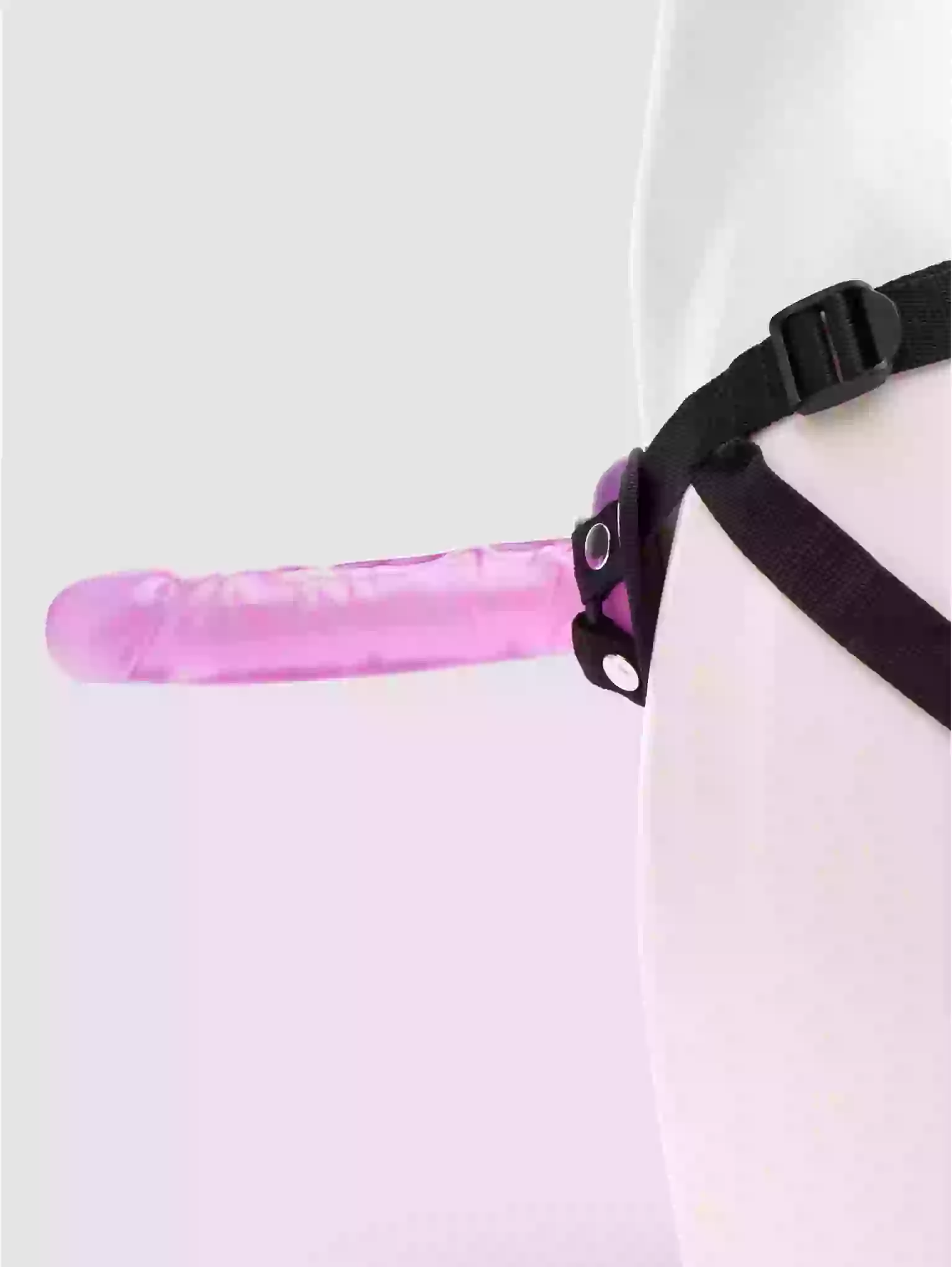 Pink object with a black strap on a white background