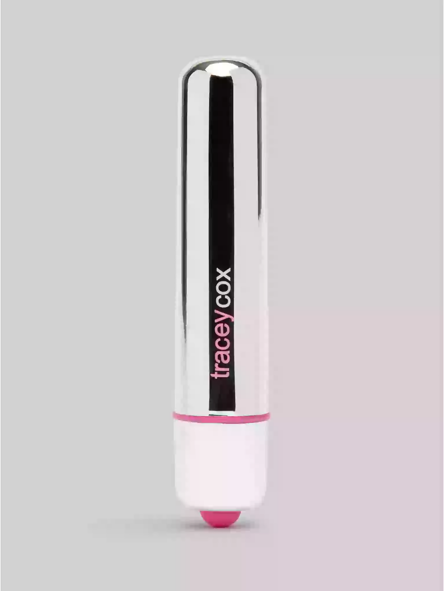 Lipstick with 'tracey cox' branding on a gray background
