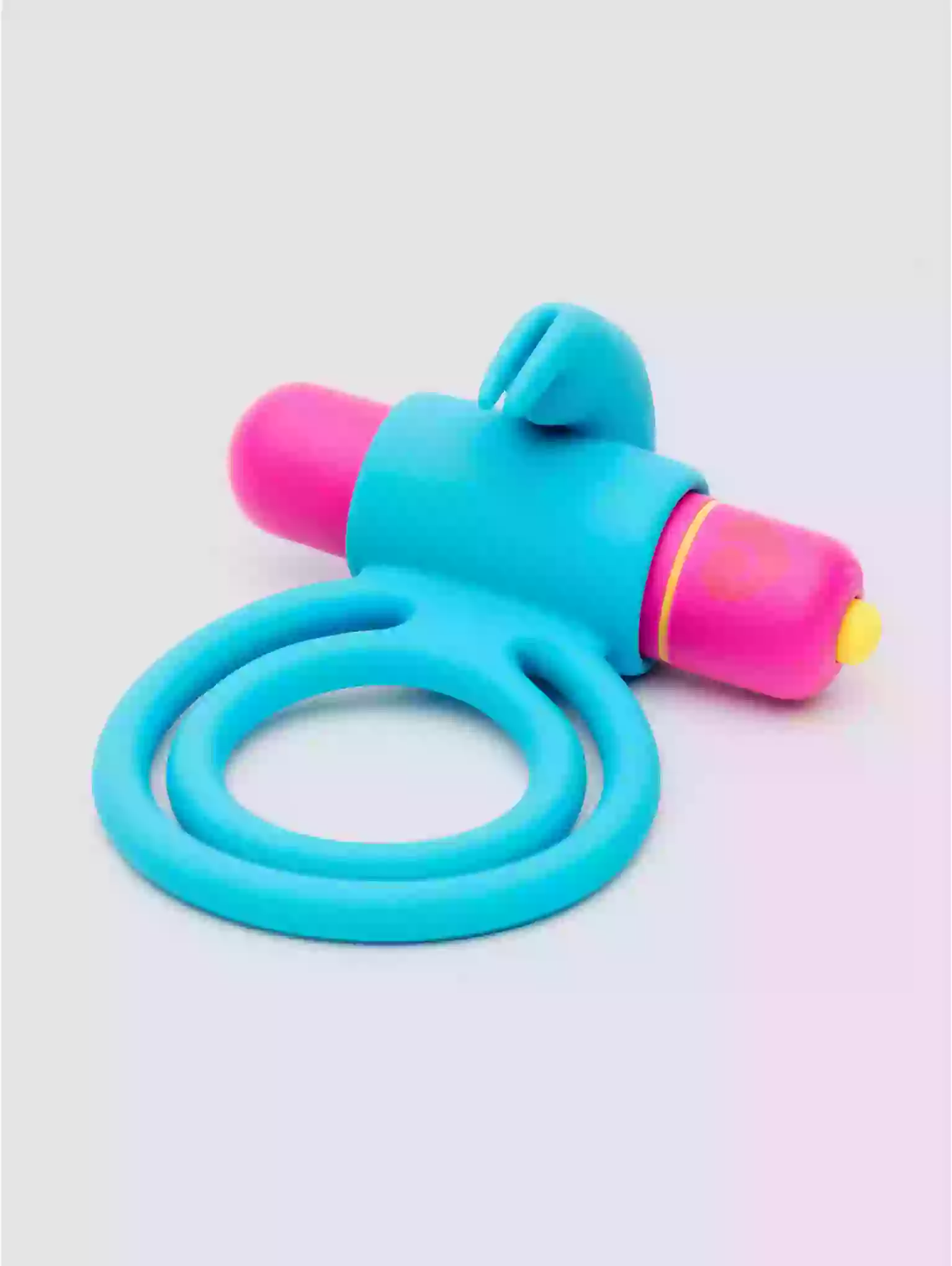 Colorful children's garden hose on a light gray background