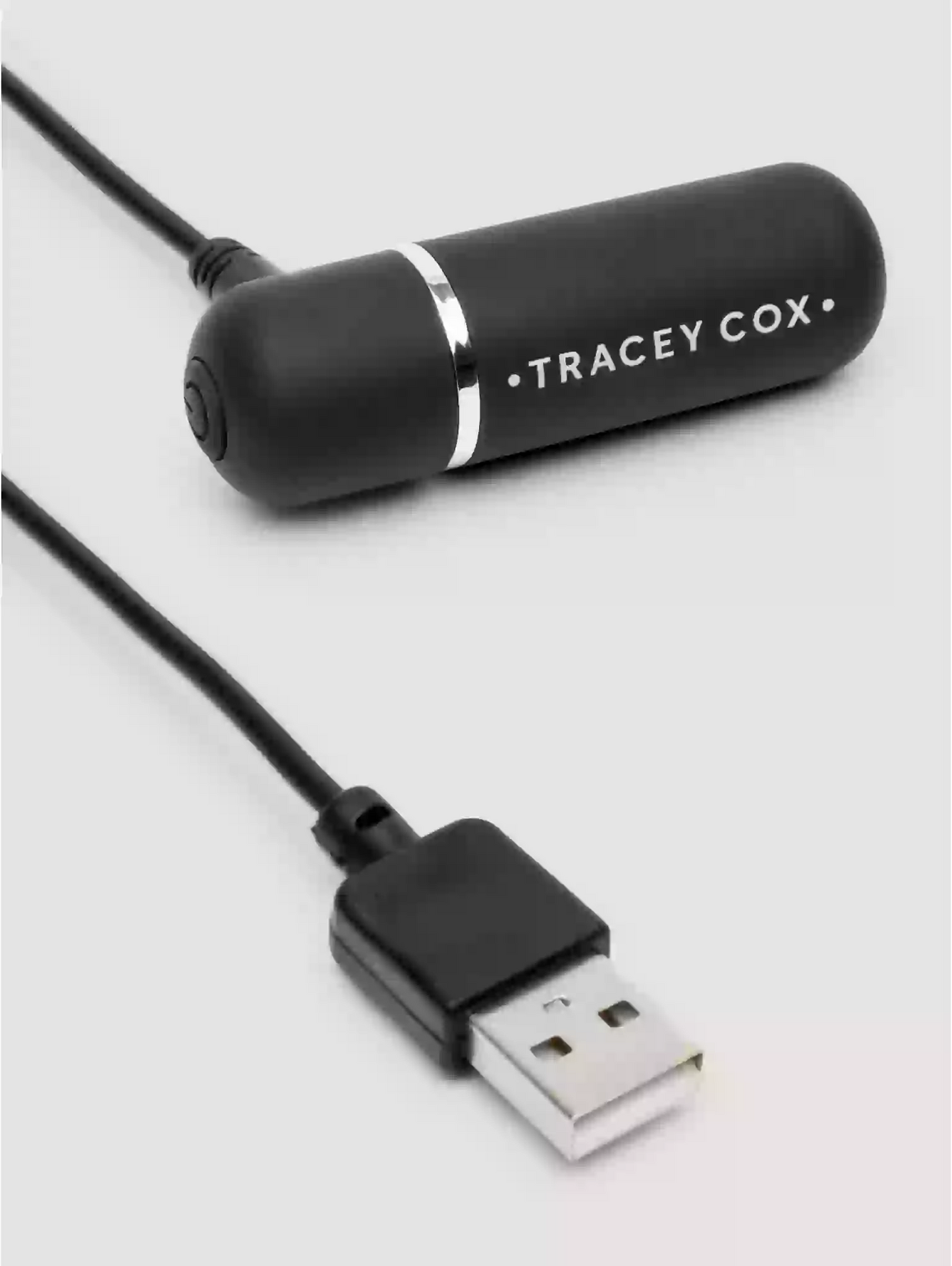 Black USB device with 'Tracey Cox' branding on a light gray background