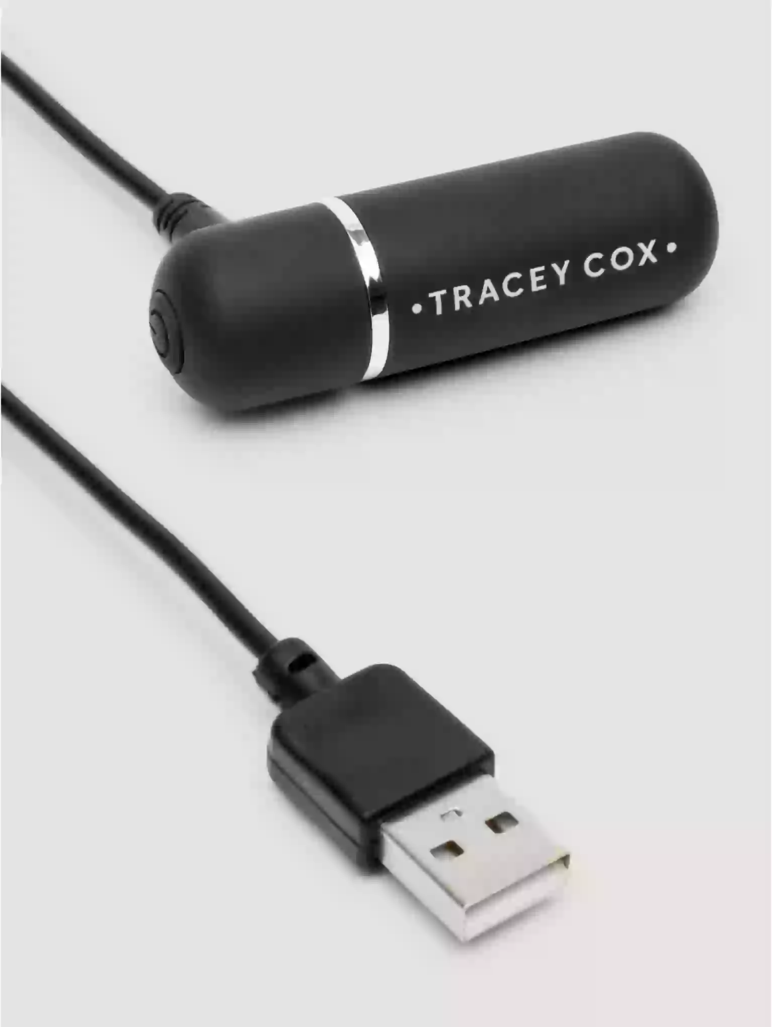 Black USB device with 'Tracey Cox' branding on a light gray background