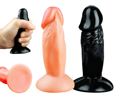 Three silicone butt plugs in black, pink, and red on a white background.