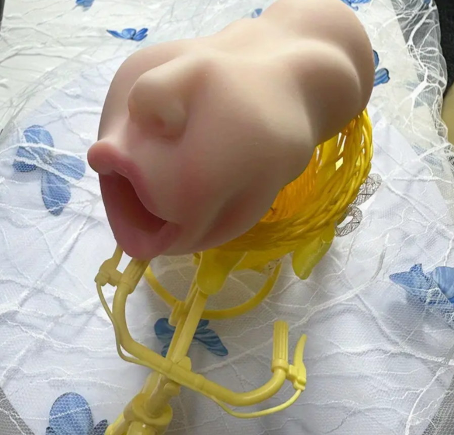 Close-up of a child's face with a yellow toy on a patterned background