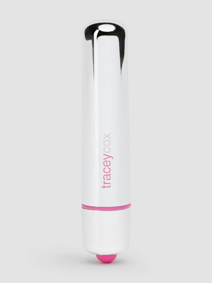 White and pink lip balm with 'tracey zoe' branding on a light gray background