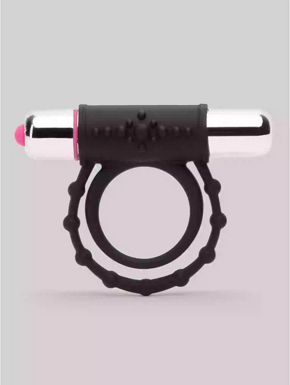 Black and silver device with pink tip on a light gray background