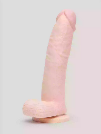 Pink and beige object on a light gray background