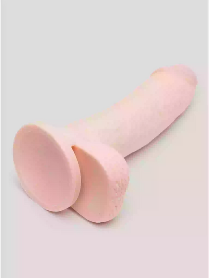 Two pink silicone cups on a light gray background