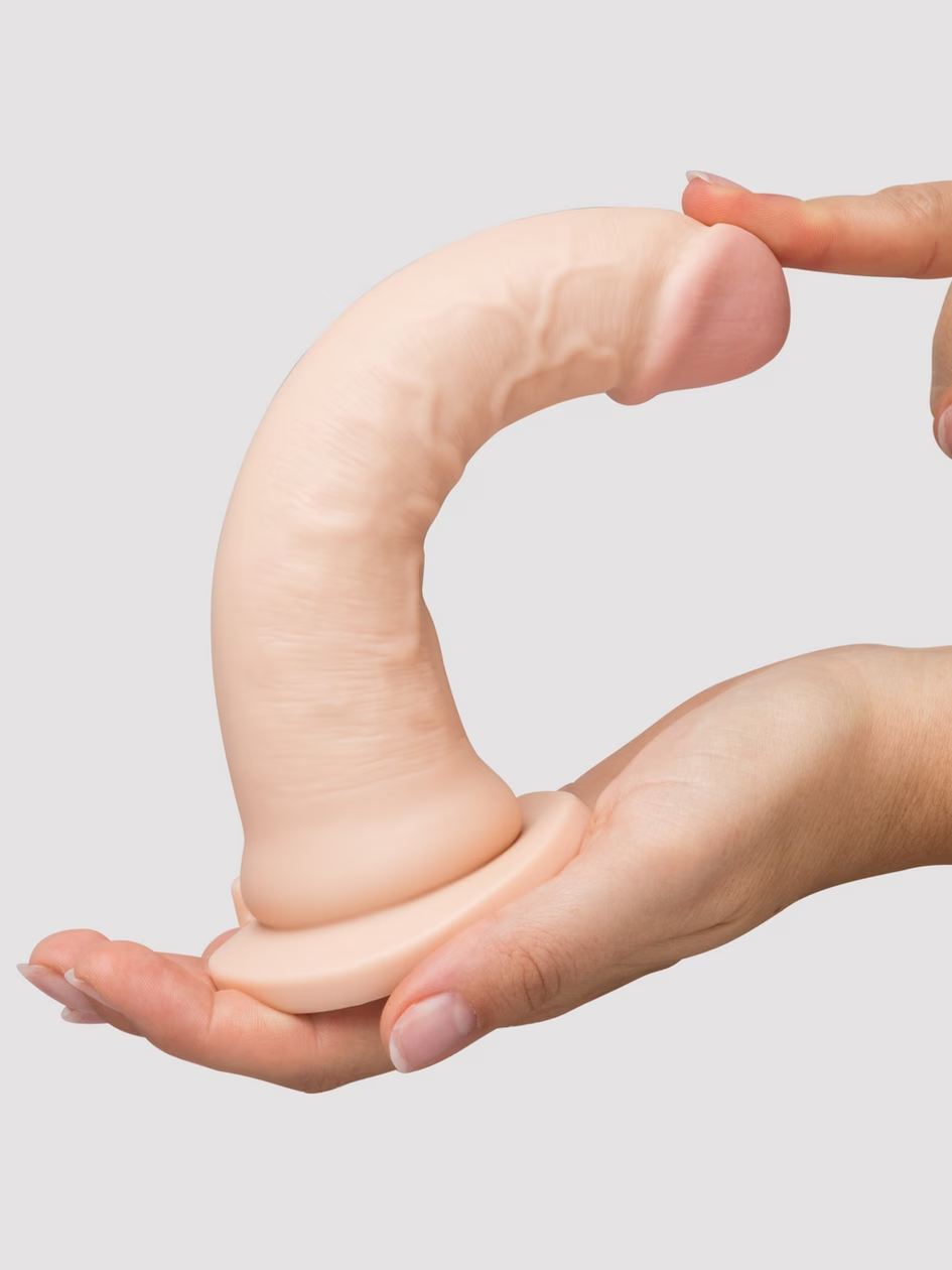 Hand holding a silicone sleeve against a light gray background
