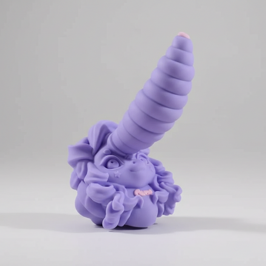 Purple unicorn figurine with a textured body on a gray background