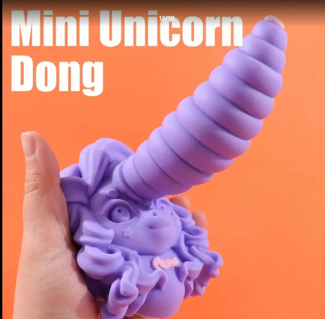 Purple unicorn-shaped toy held by a hand with an orange background and text 'Mini Unicorn Dong'.