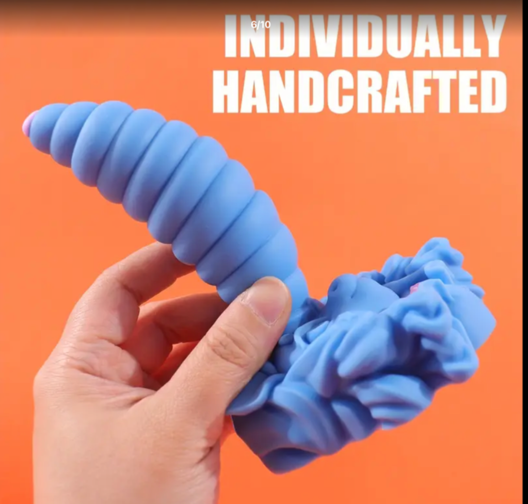 Blue handcrafted object held by a hand against an orange background with 'INDIVIDUALLY HANDCRAFTED' text.