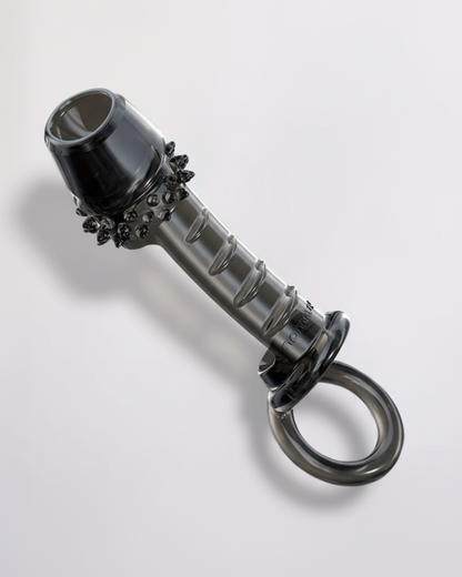 Metallic object with decorative elements on a white background