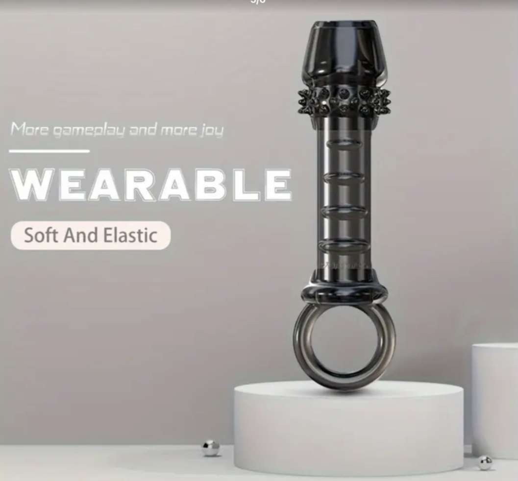 Black and gray wearable device on a white platform with a light gray background