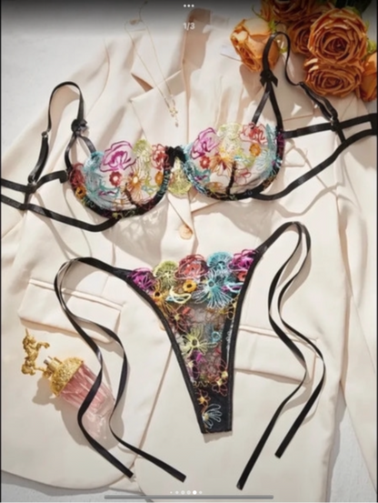 Floral embroidered lingerie set on a light background with flowers.