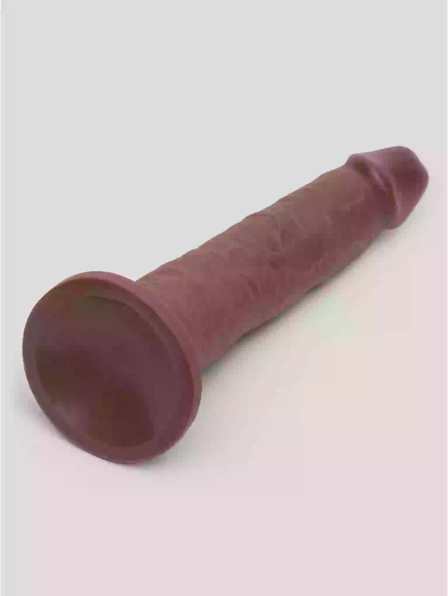 Red rubber cone on a white background